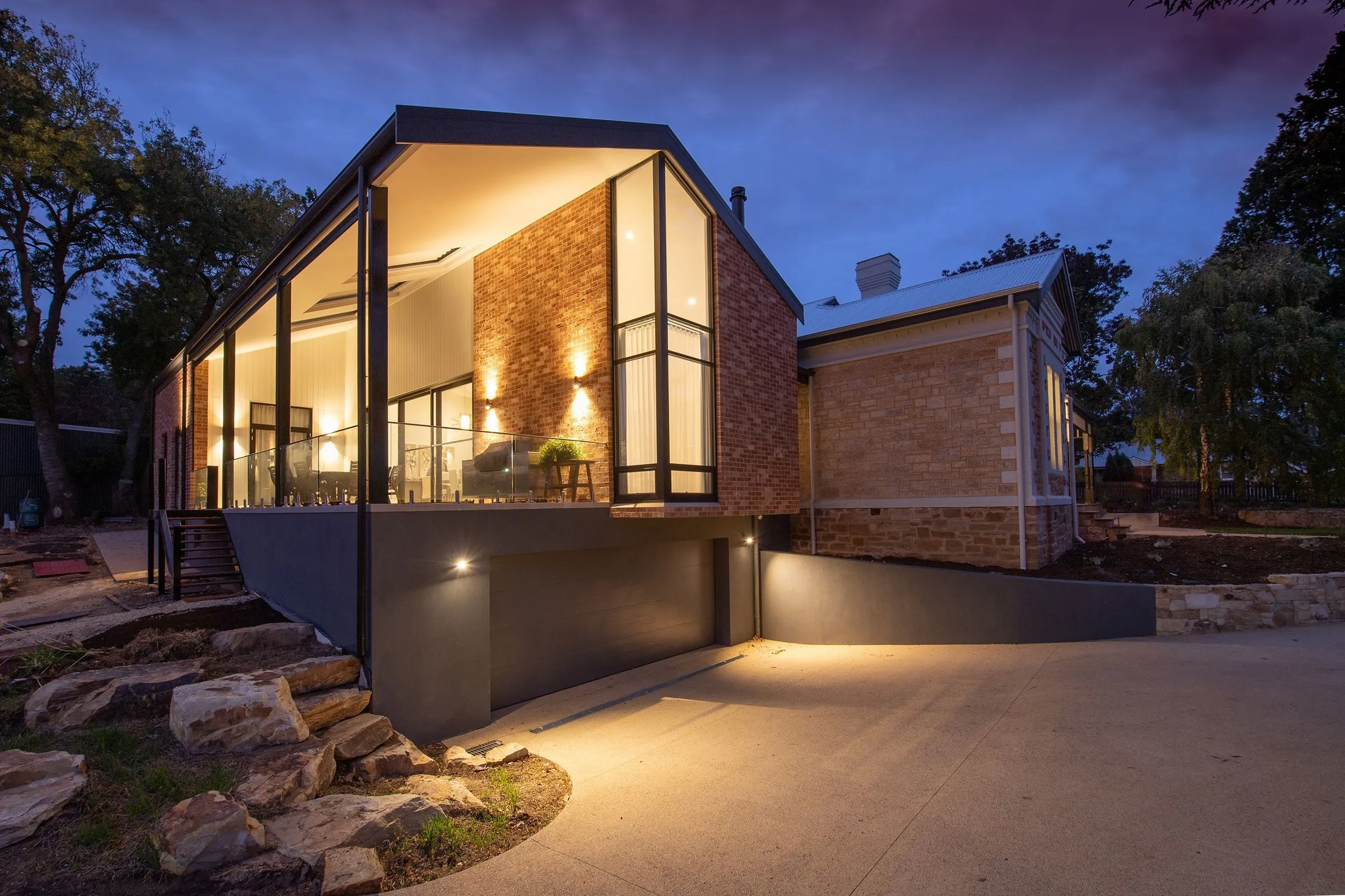 Modern independent house with large windows at dusk
